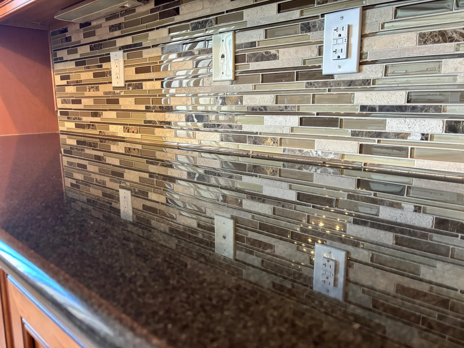 Dark granite countertop after hot steam cleaning and polishing in a Las Vegas area home