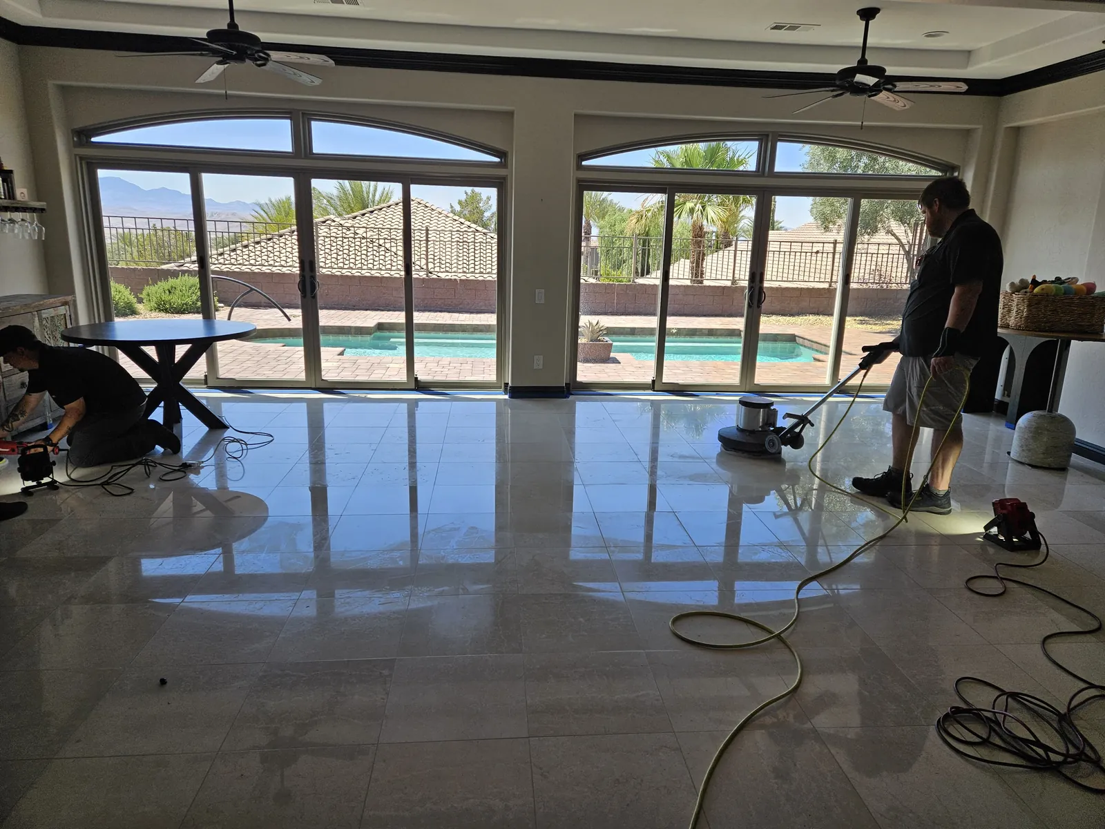 Expert Stone Repair technicians chemically polishing marble floors in a Henderson home