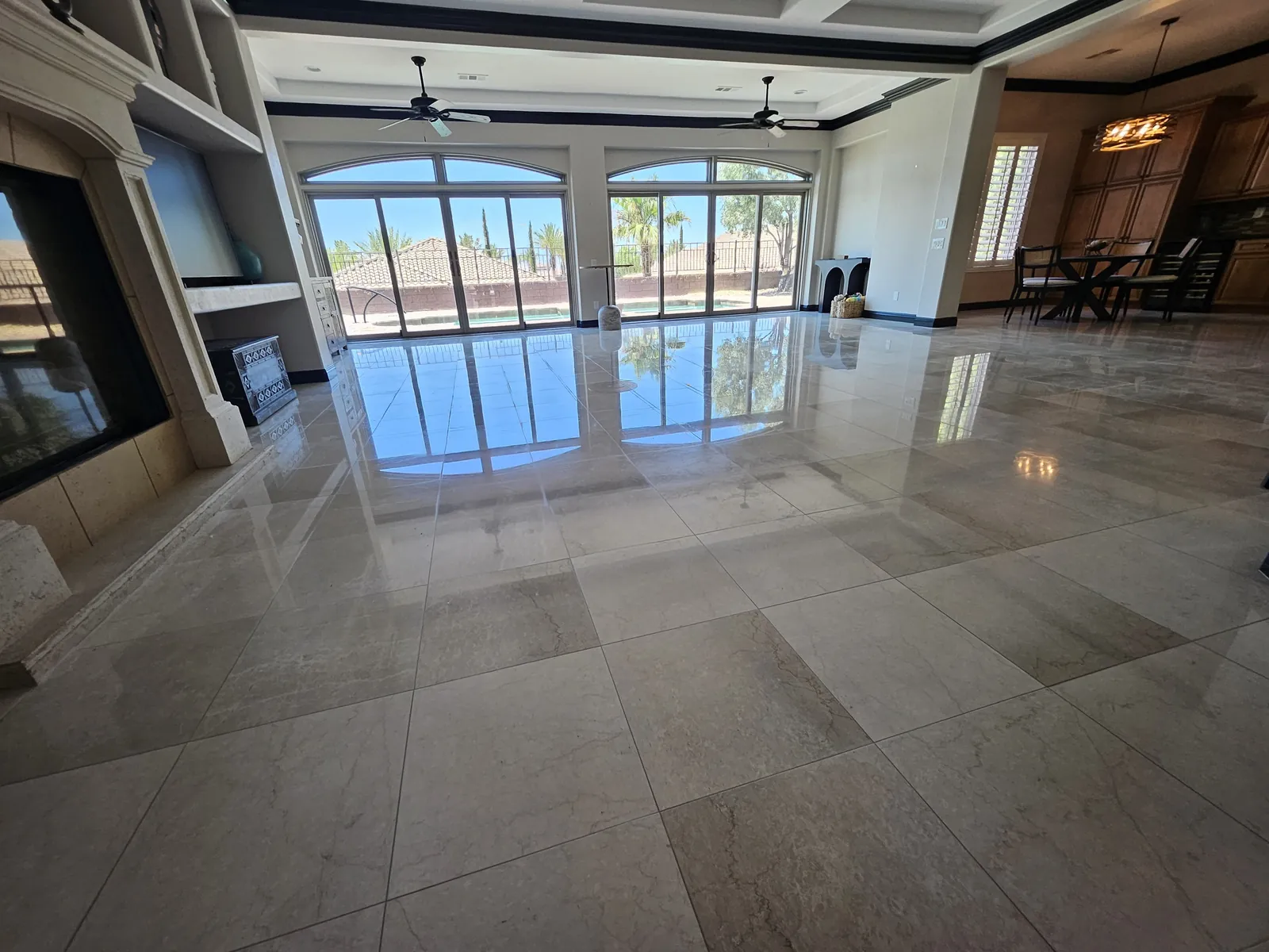 Polished marble living room floor in Henderson with clear window reflections
