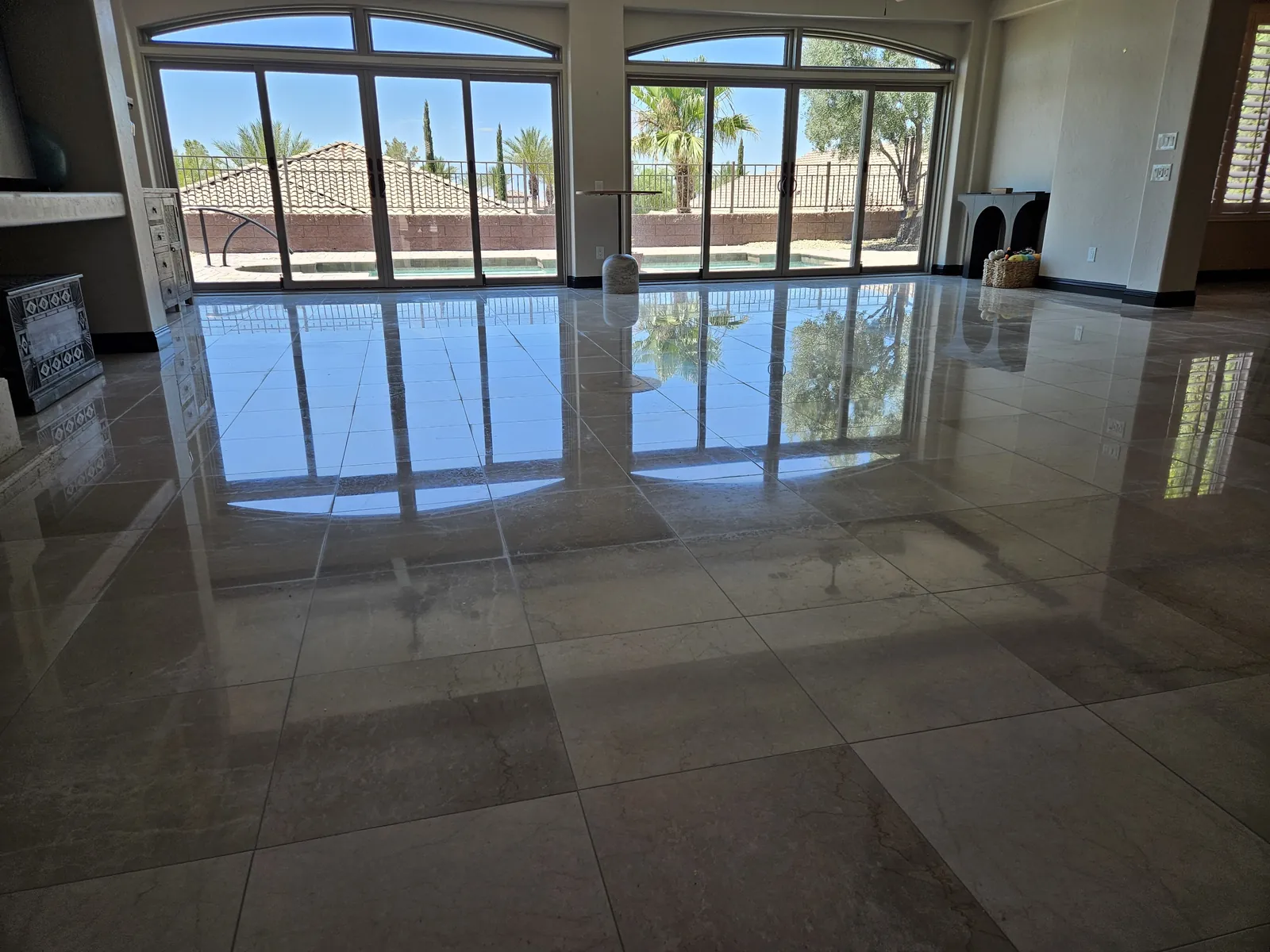 Finished marble floor reflecting the back windows of a Henderson home