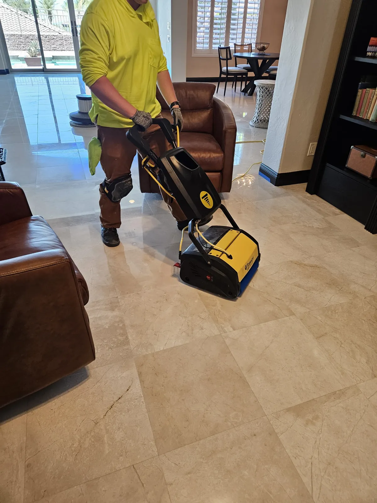 Floor machine cleaning and polishing marble tile in a Henderson living room