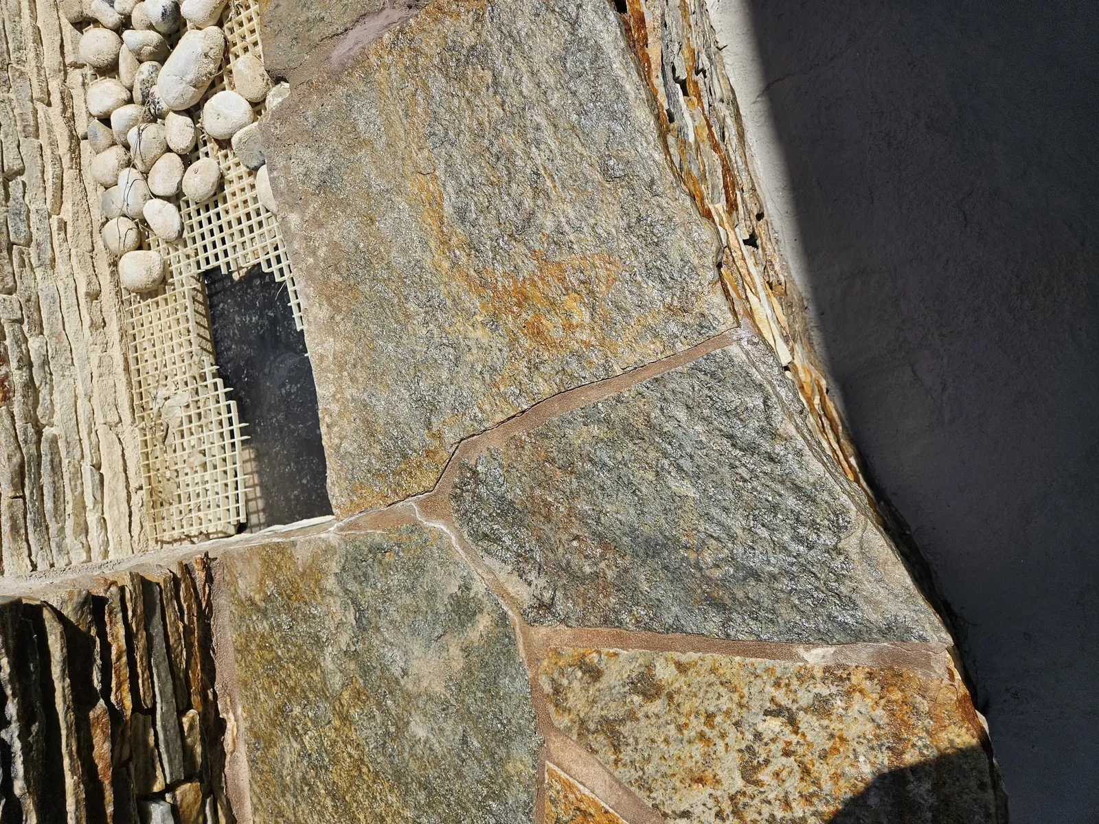 Fountain basin and cap stones after joint repair and cleaning