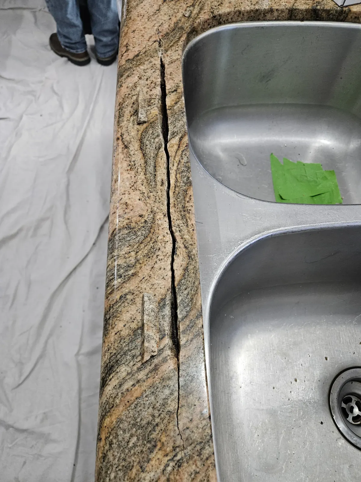 Cracked granite countertop before repair in Henderson