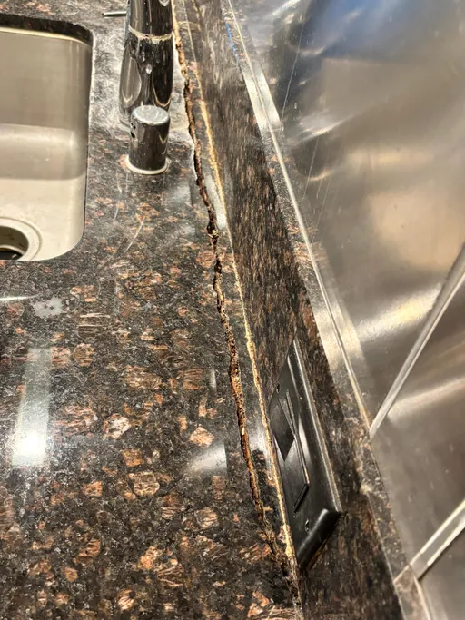 Granite countertop crack before and after repair in a Las Vegas kitchen (before)
