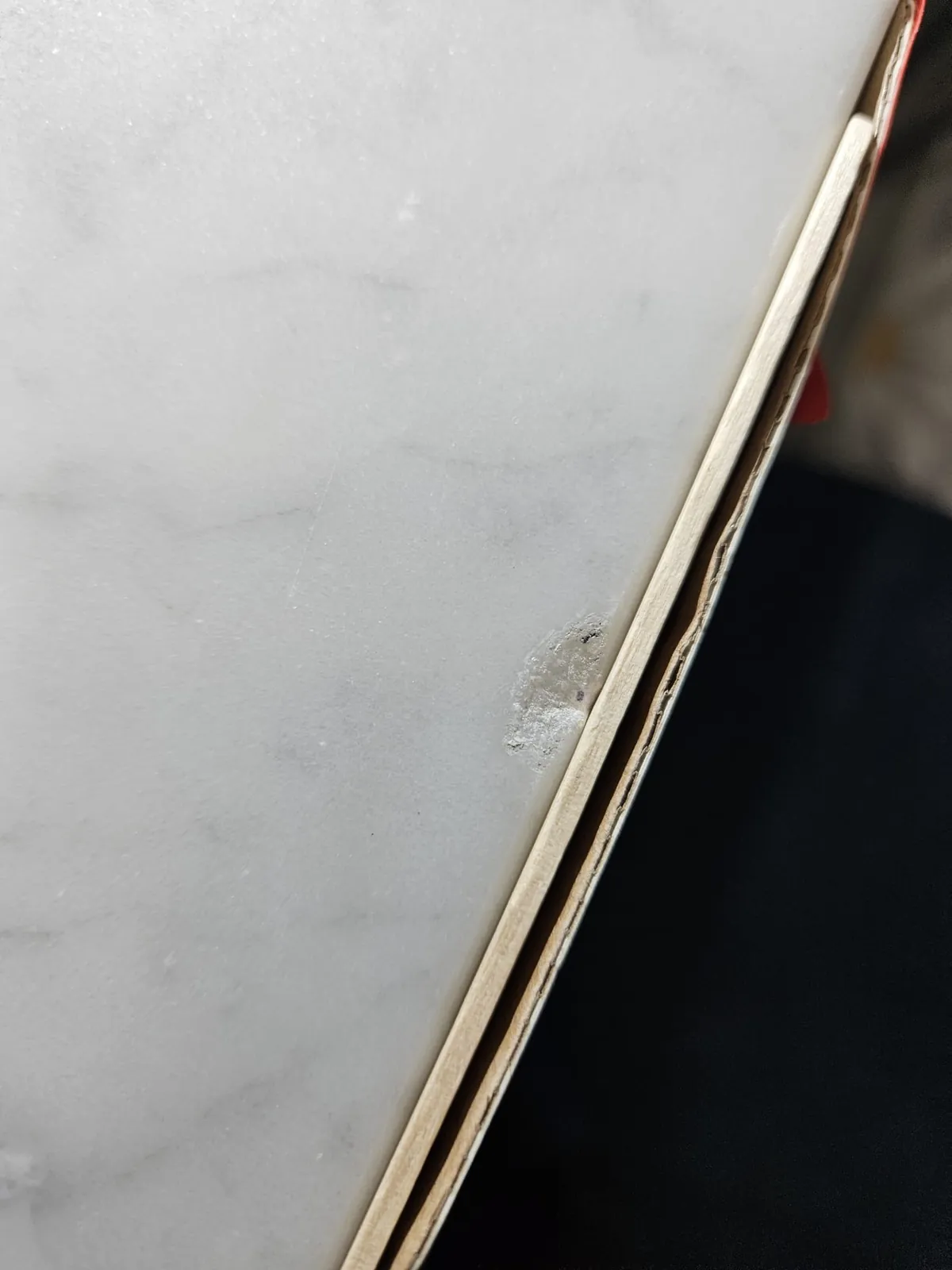 Marble countertop edge chip before repair