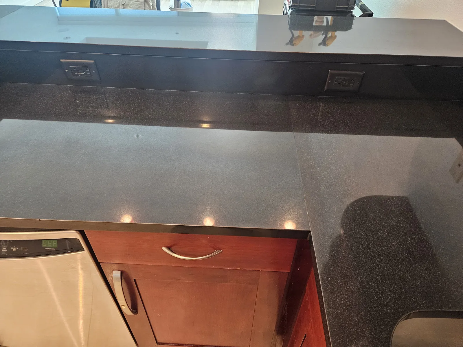 Close-up of polished black granite countertop near Panorama Towers