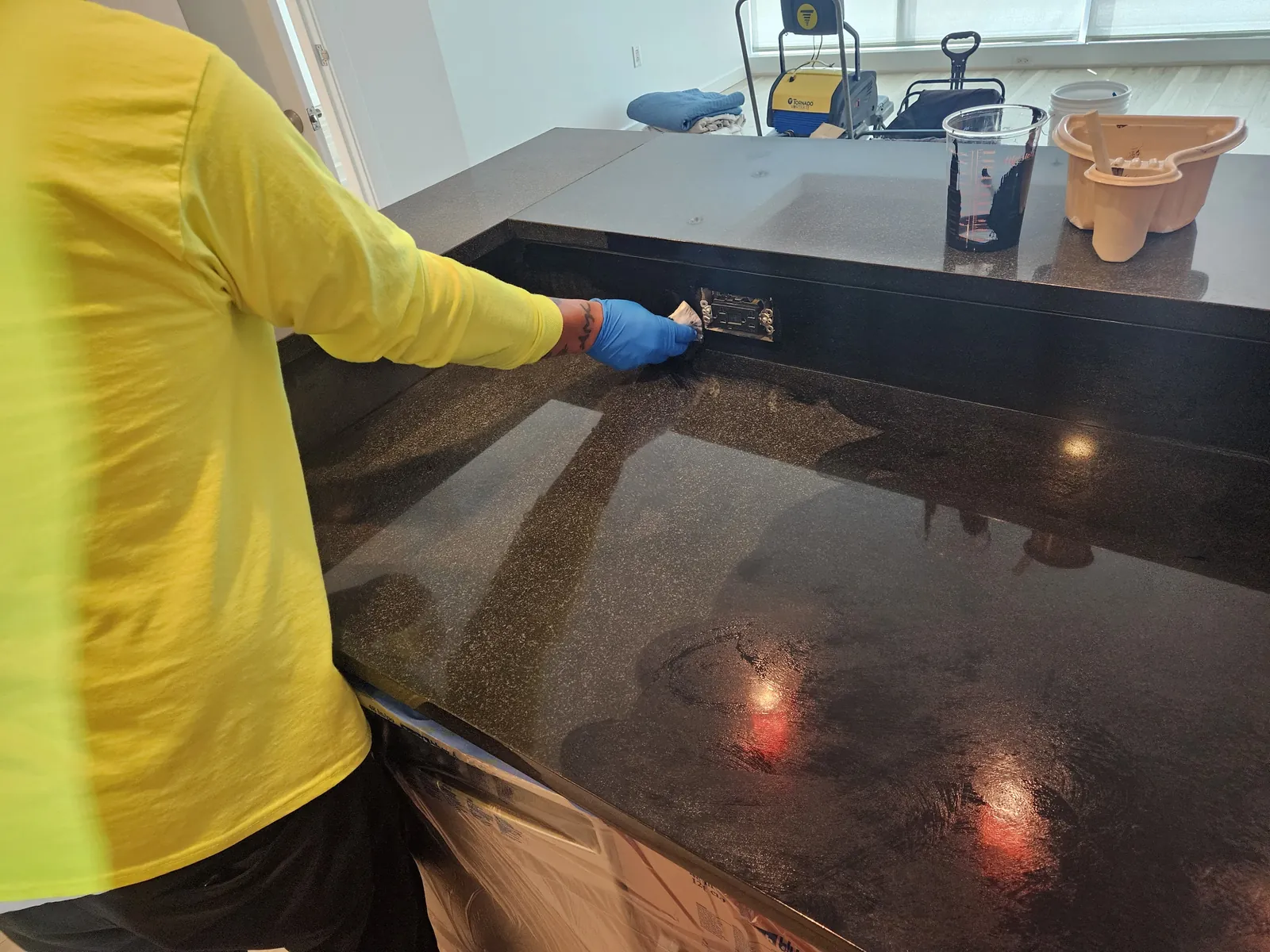 Sealing a polished black granite countertop near Panorama Towers