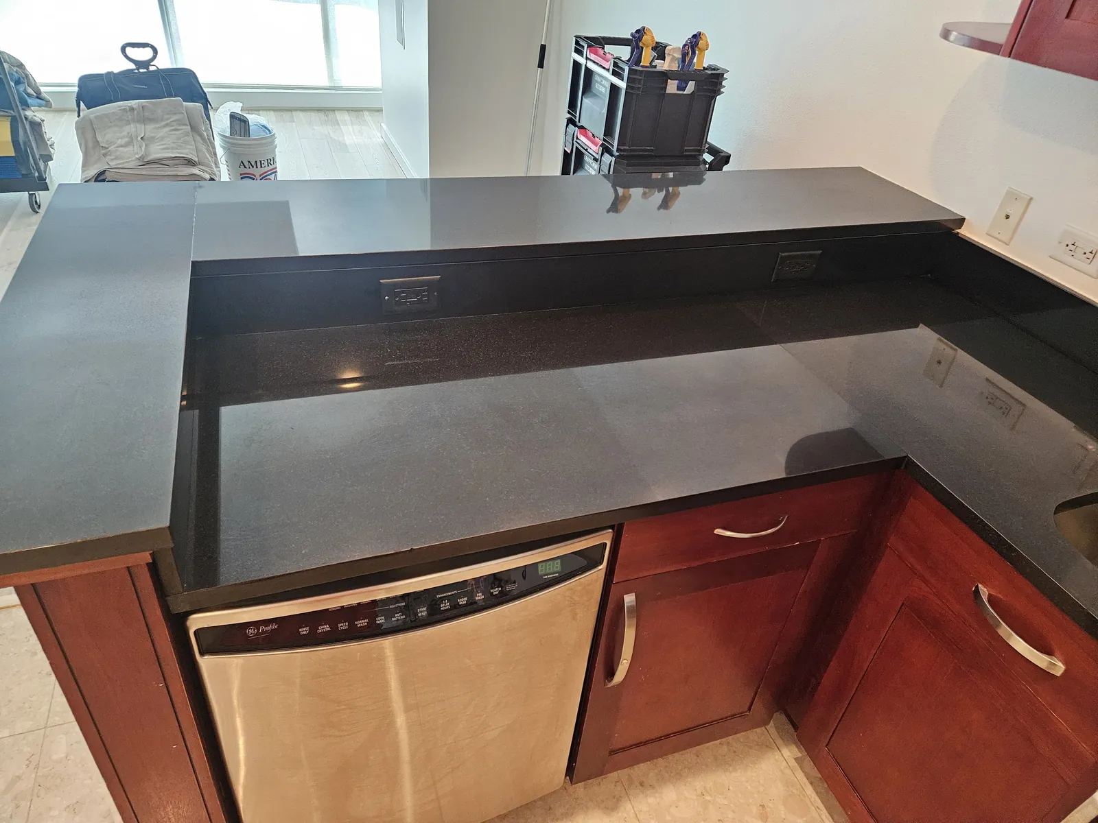 Black granite kitchen countertop polished and restored near Panorama Towers