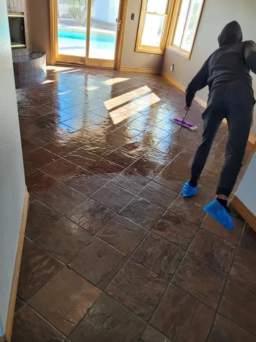 Sealer being applied to polished slate floor