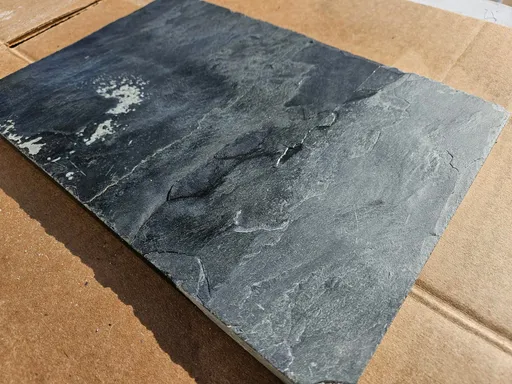 Slate tile sample showing natural texture before polishing