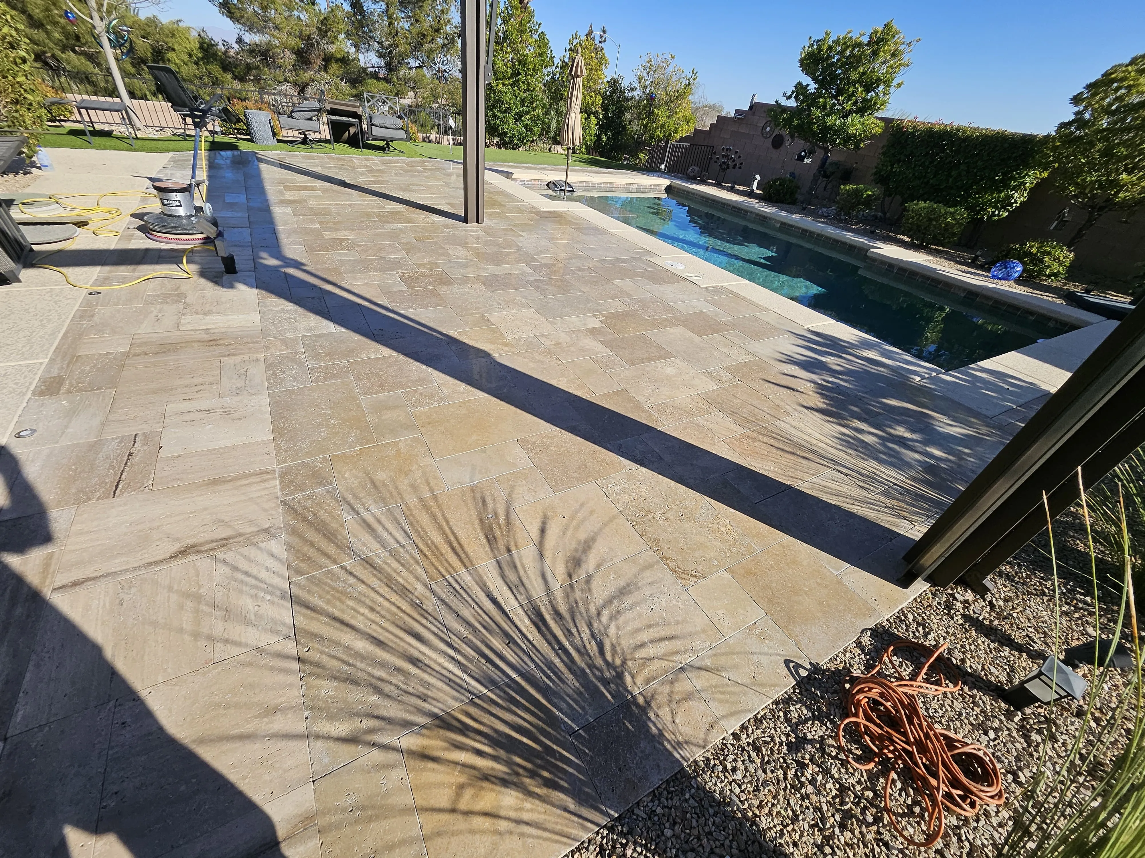Travertine pool deck after cleaning and restoration, aerial view Las Vegas