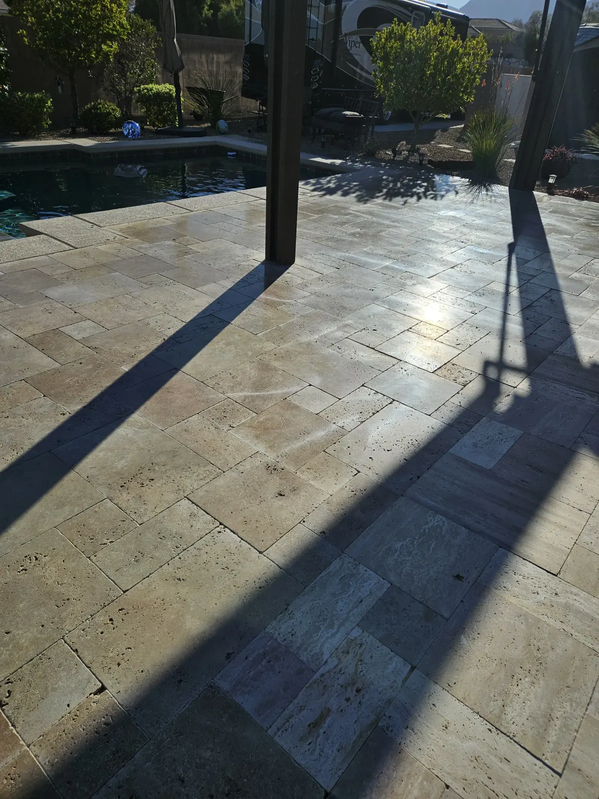 Restored and sealed travertine pool deck in Henderson