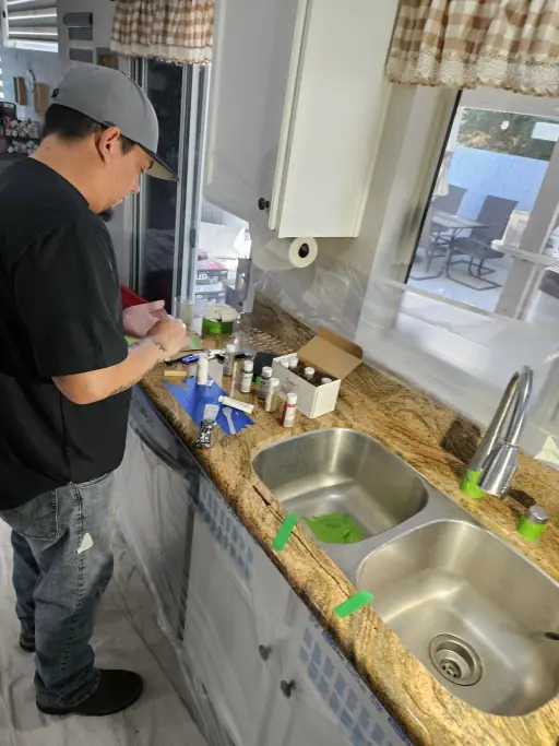 Technician prepping materials for granite countertop repair in Henderson