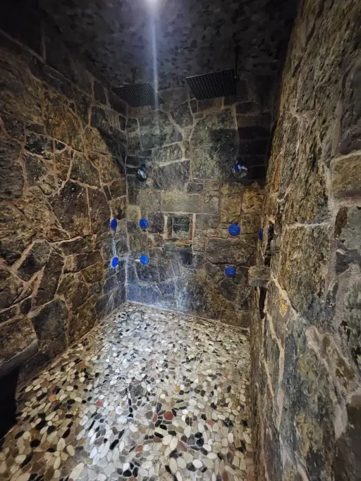 Stone shower water feature restoration