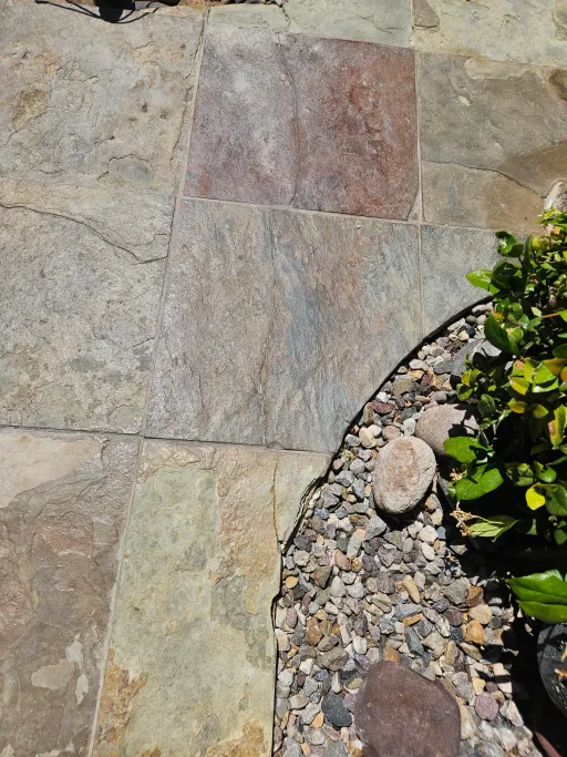 Close-up of faded paver surface before restoration