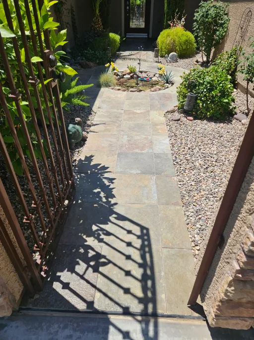Faded stone paver walkway before cleaning and sealing