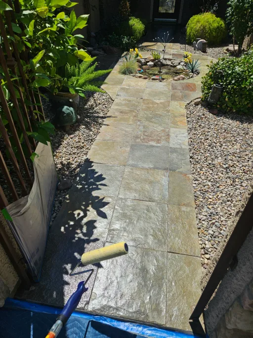 Applying sealer to stone pavers with roller